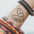 black heart tattoo on wrist